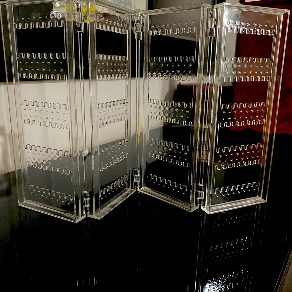 Clear, folding earring holder